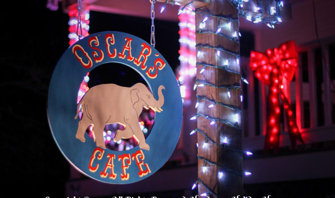 Close Up Shot Of Oscar's Cafe Sign Lights By Handsome Holiday Heroes!